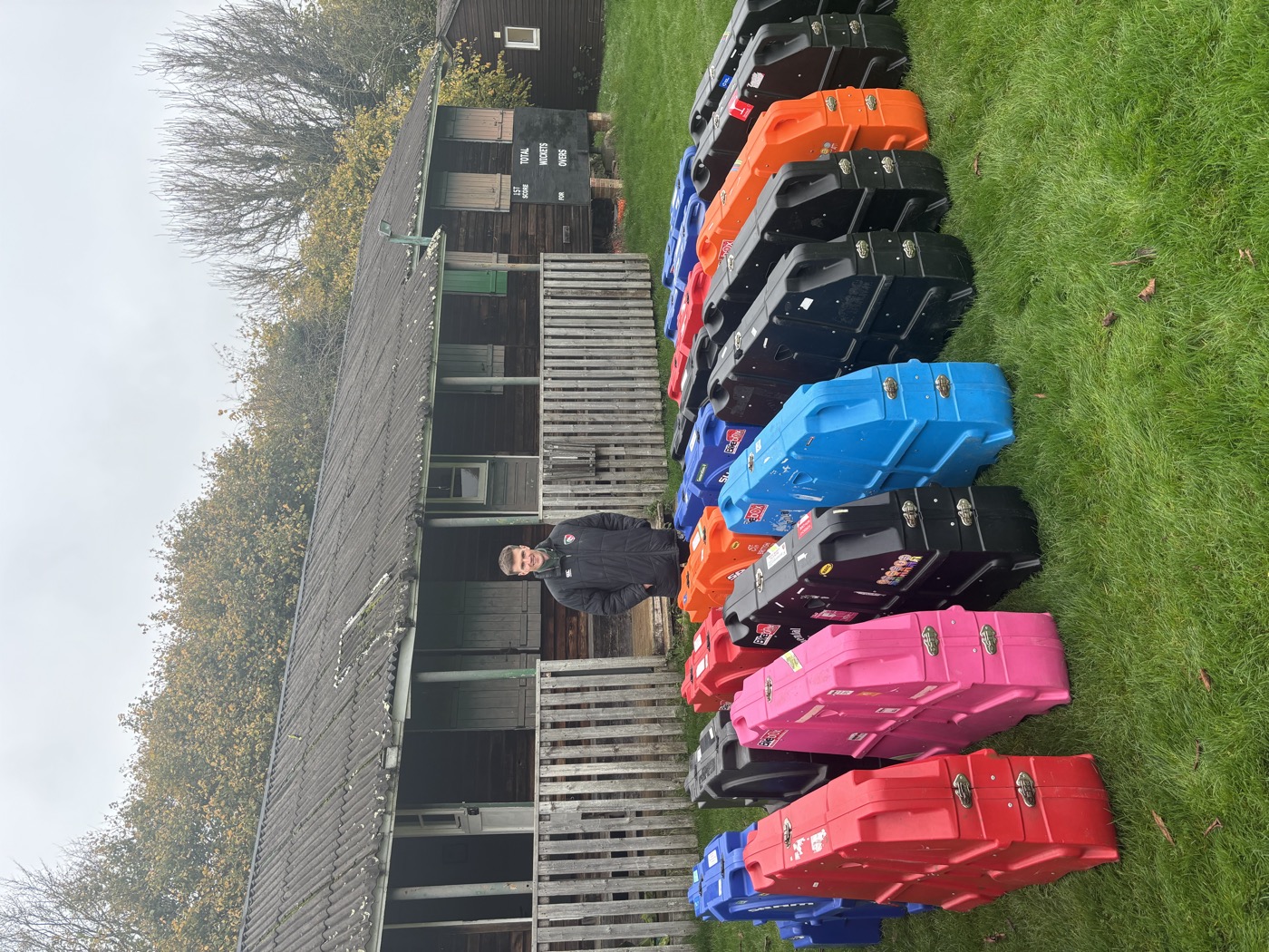Charlie, founder of Bike Box Hire UK, with a line of bike boxes